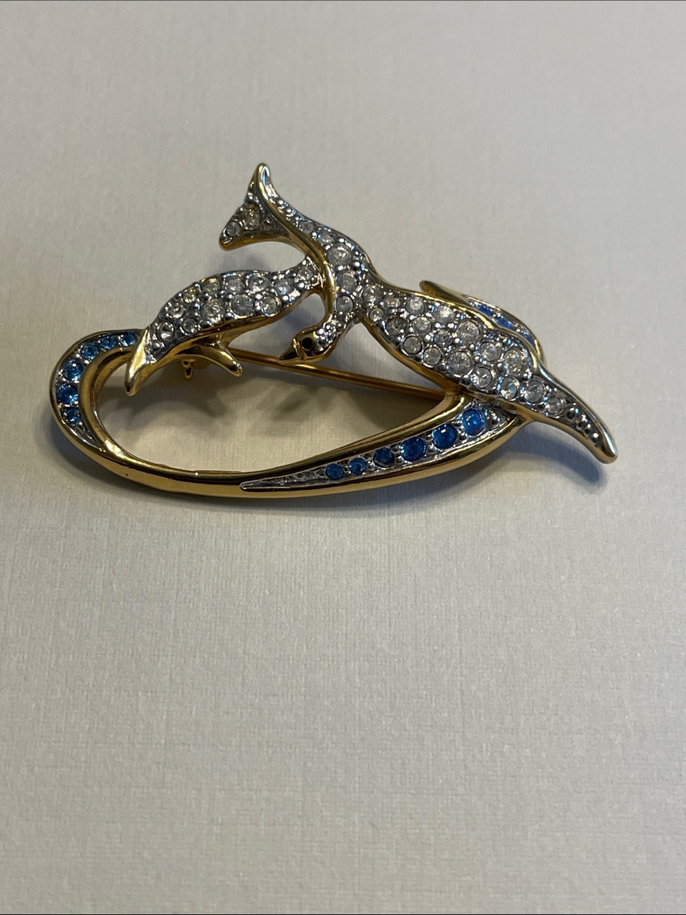 Vintage Swarovski "Freedom Dove" brooch featuring clear and blue crystals